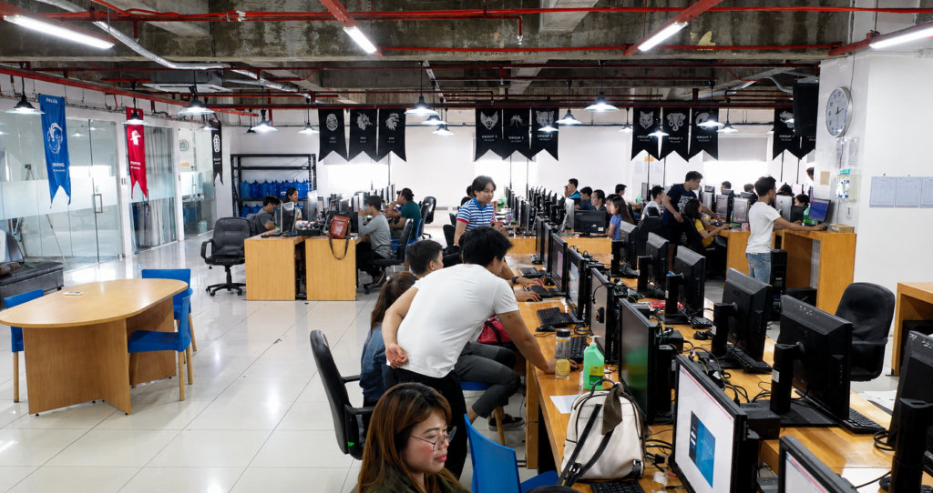 Human quality control team reviewing AI-edited real estate images