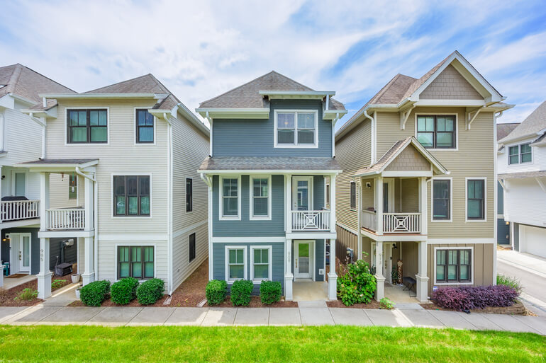 Before and after real estate photo editing showing HDR exposure blending, color correction, and improved image consistency.