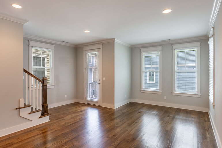 Before and after of a vacant living room using AI virtual staging
