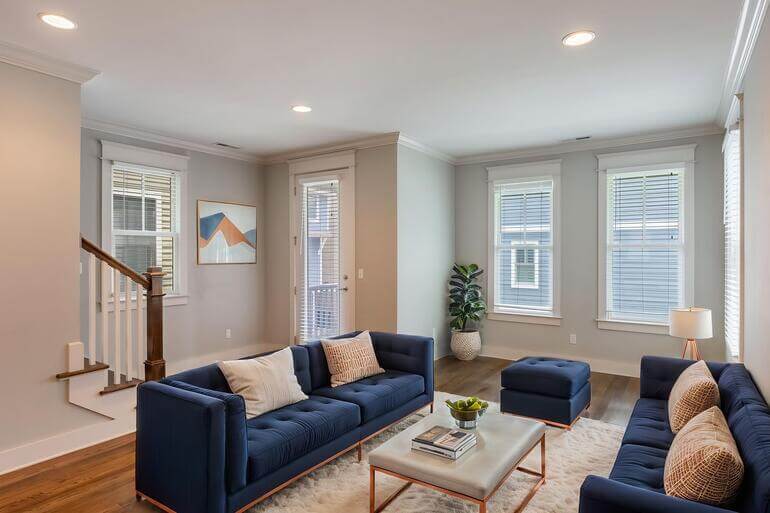 Before and after of a vacant living room using AI virtual staging