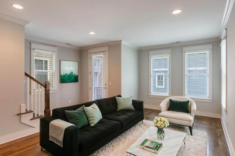 Before and after of an empty living room using AI virtual staging