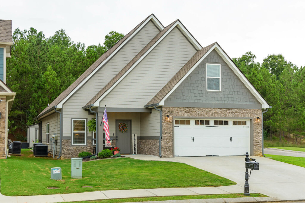 Home exterior with driveway and roadside vehicle removed.