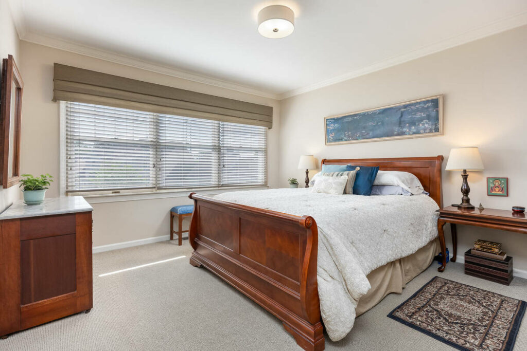 Bedroom after AI photo editing for real estate.