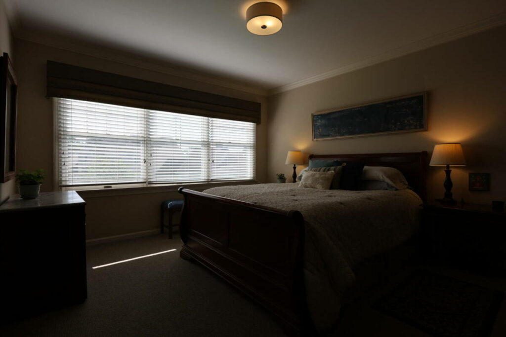 Bedroom before AI photo editing for real estate.