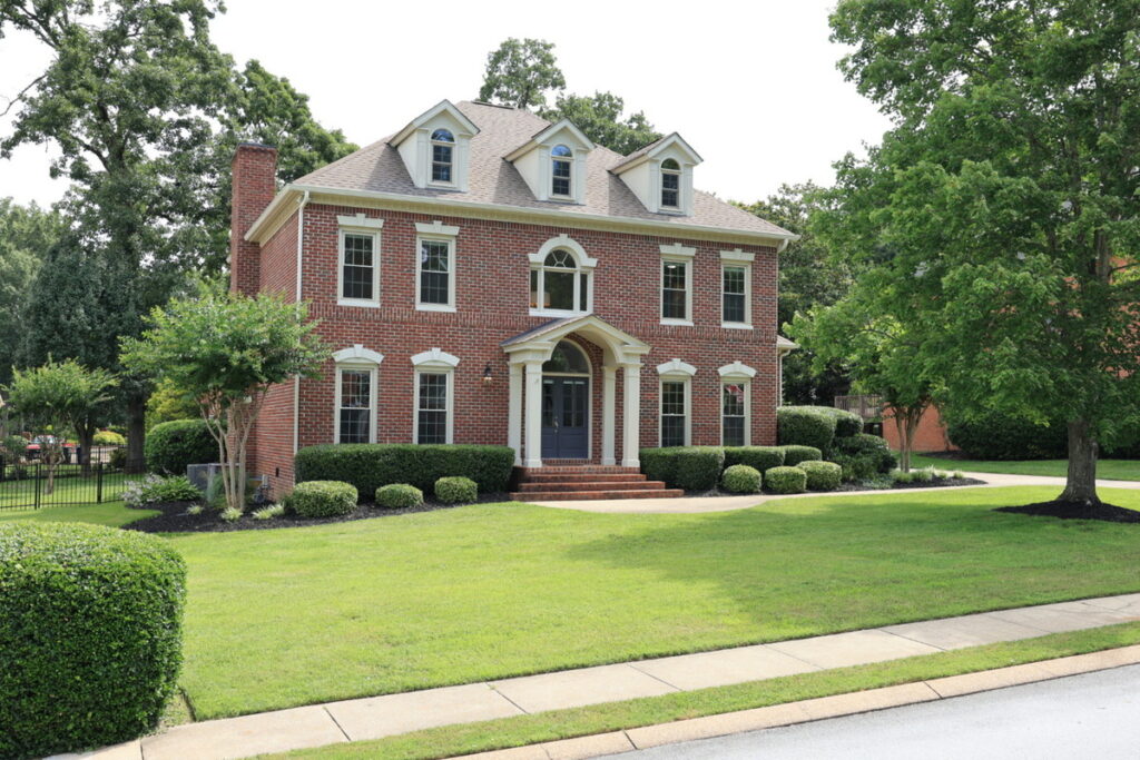 House exterior before real estate photo enhancement.
