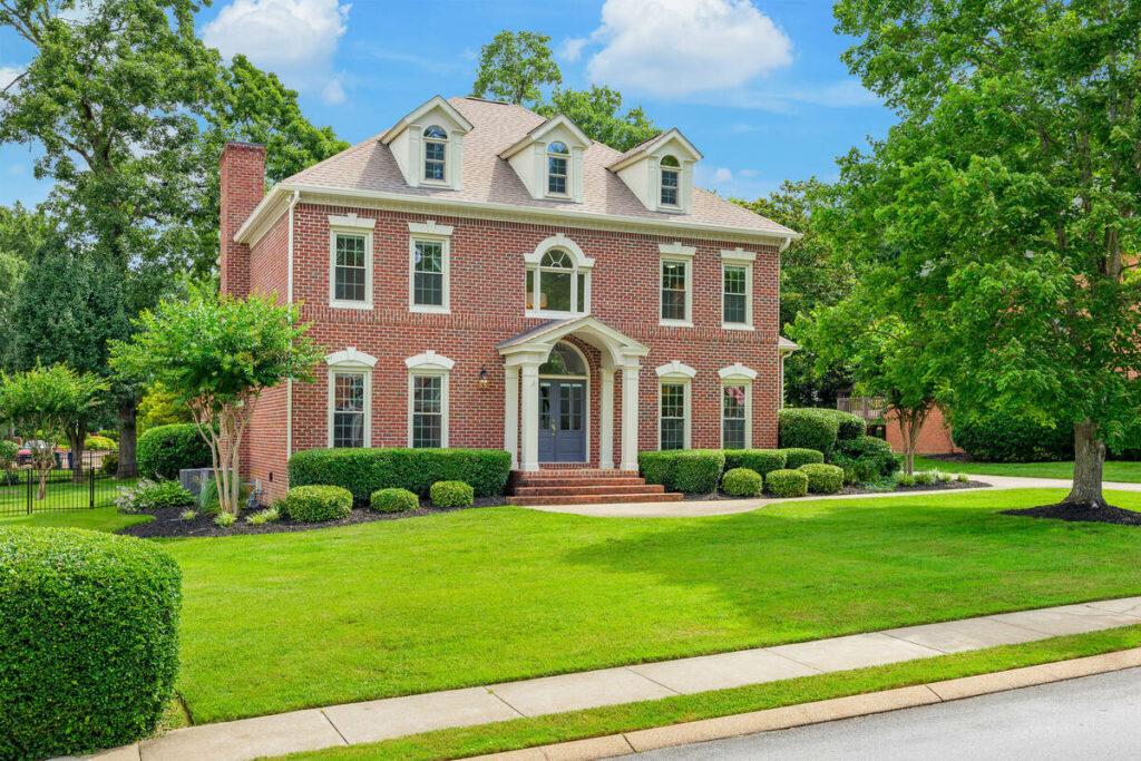 Brick home exterior enhanced with real estate HDR photography.