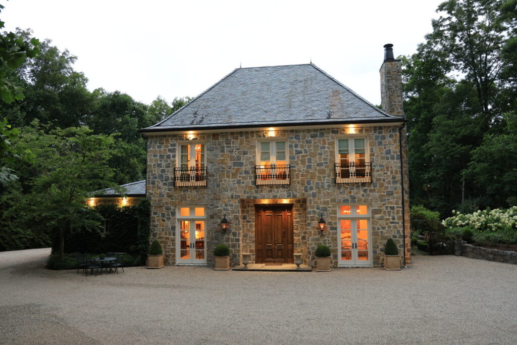 Luxury stone home before twilight photo enhancement.
