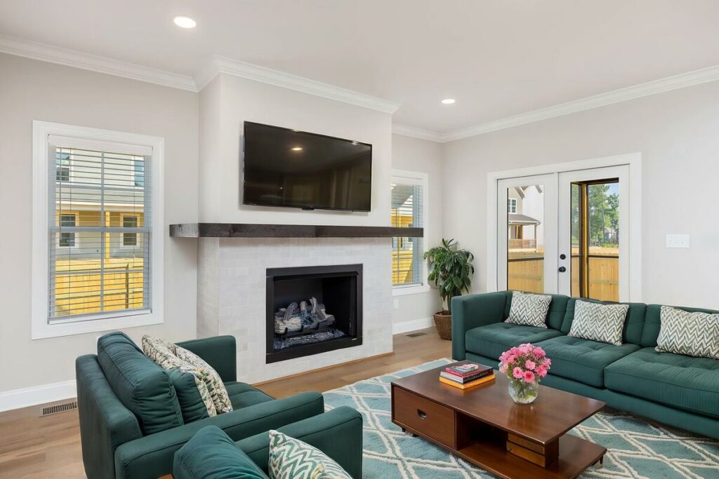 Living room with fireplace enhanced through virtual staging.