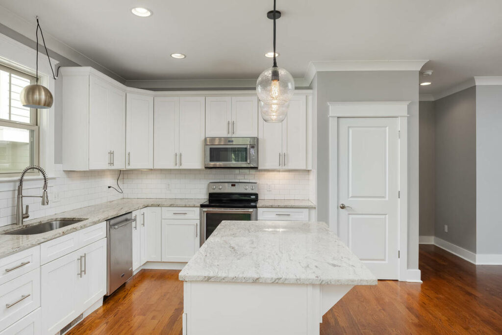White kitchen after AI photo editing for real estate listing.