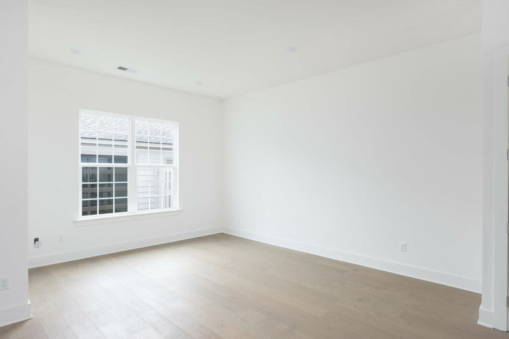 Empty white bedroom before AI virtual staging