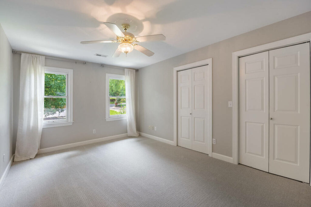 Empty primary bedroom before AI virtual staging