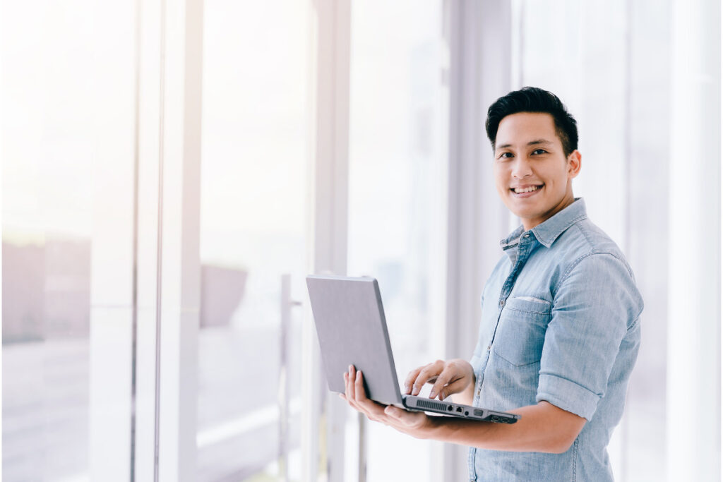 Professional working on wedding photo editing with a laptop
