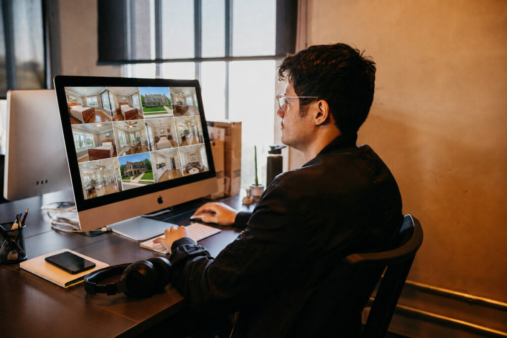 Real estate photo editor reviewing a gallery of listing photos