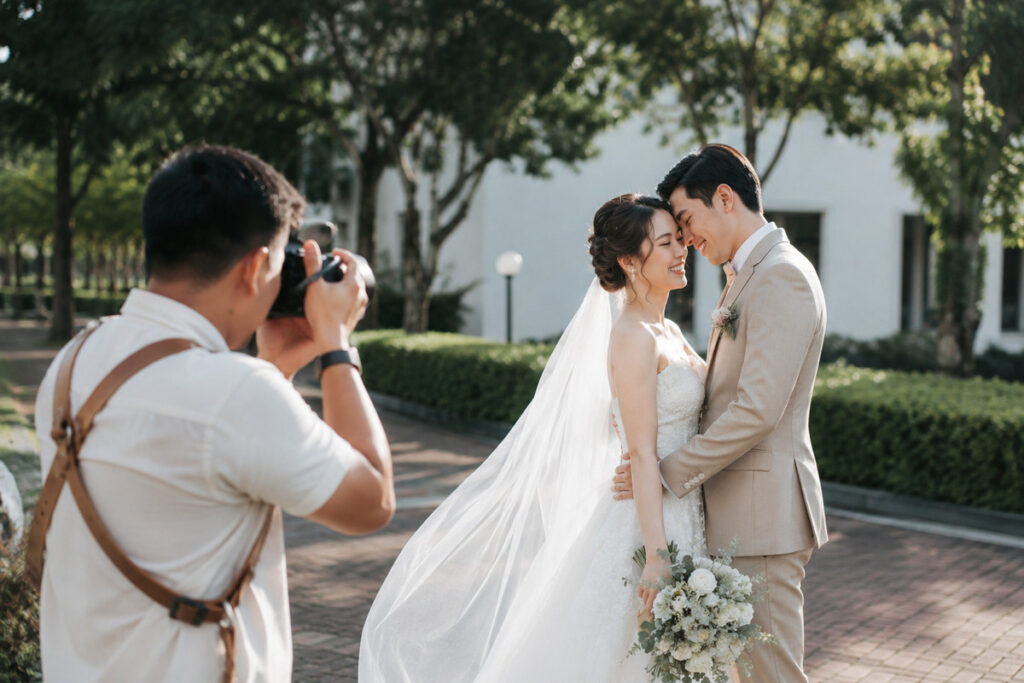 Wedding photographer capturing an outdoor couple portrait during a wedding