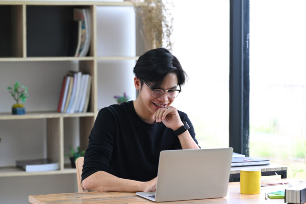 Photography coordinator working on a laptop