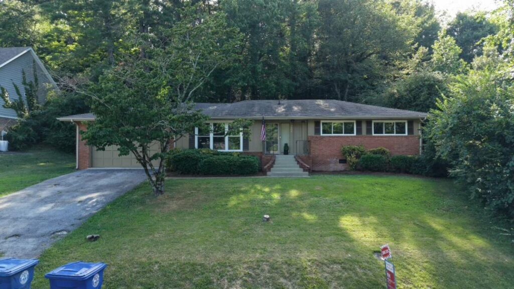 Home exterior before AI image enhancement and cleanup