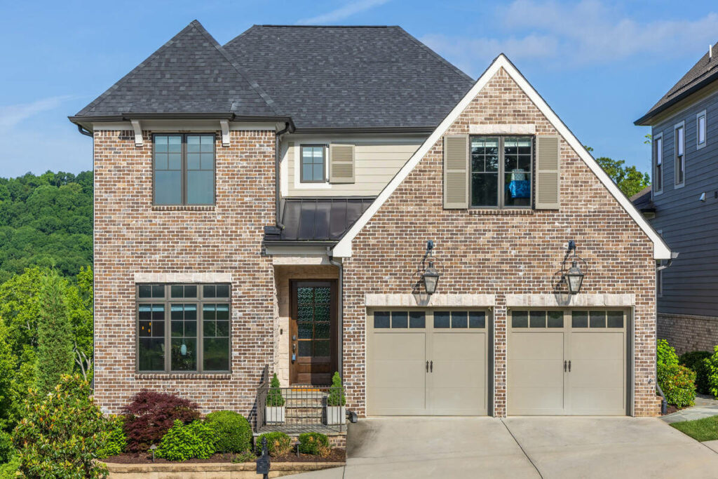 AI image enhancement of a two-story brick home exterior