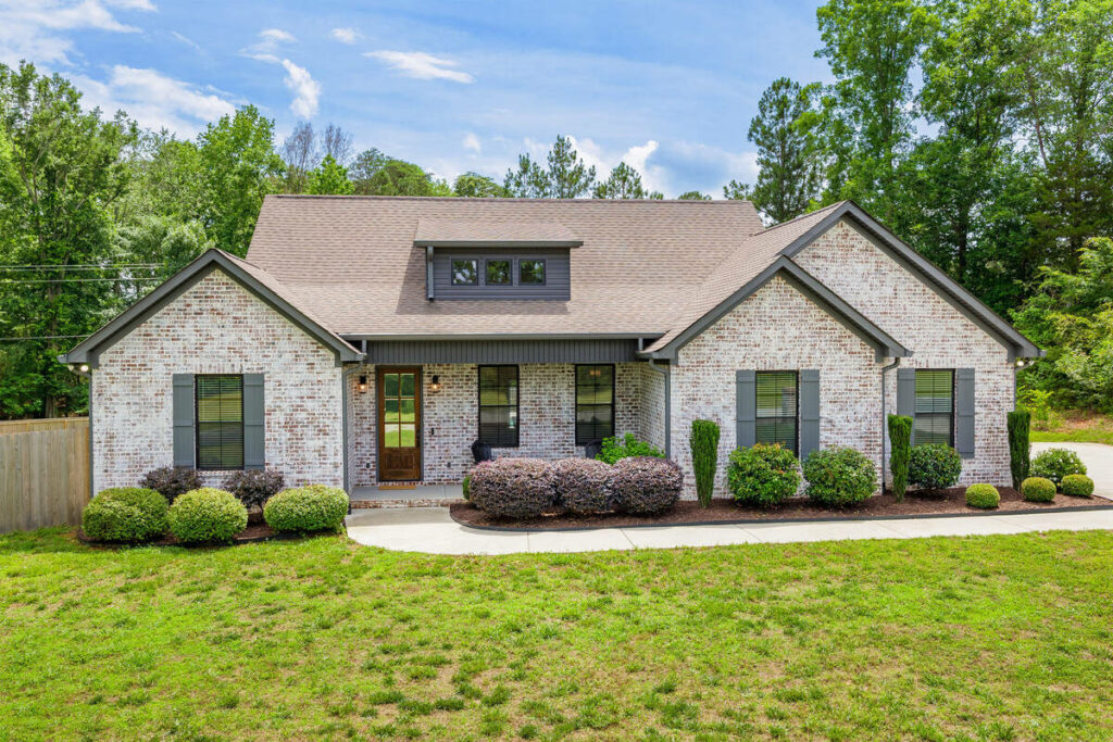 AI image enhancement of a white brick home exterior