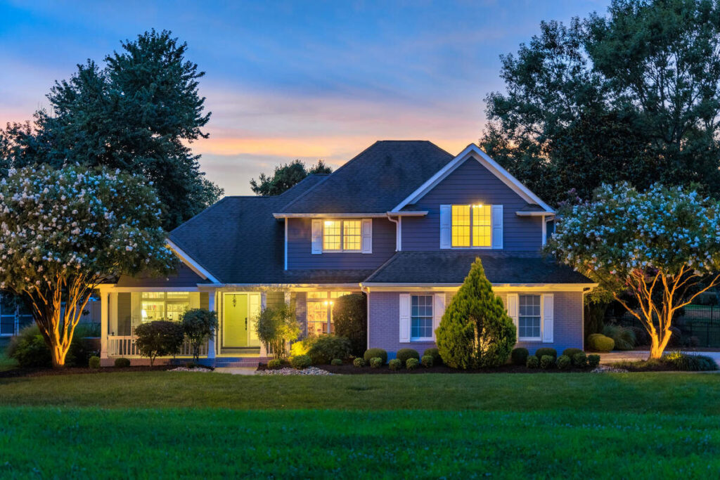 AI image enhancement brightening a twilight real estate exterior