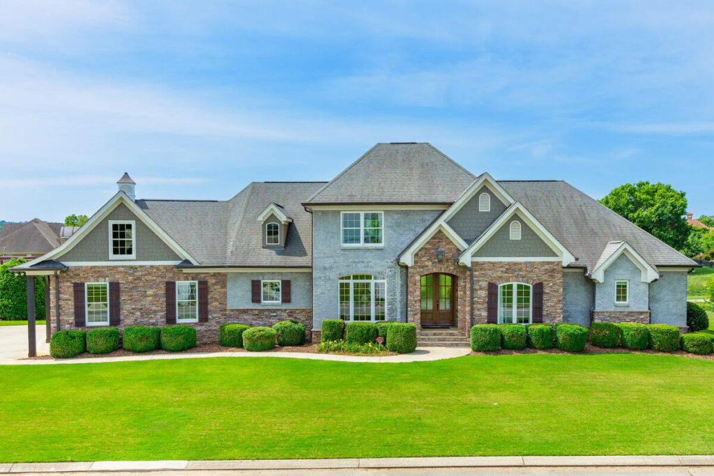 AI image enhancement of a luxury stone home exterior