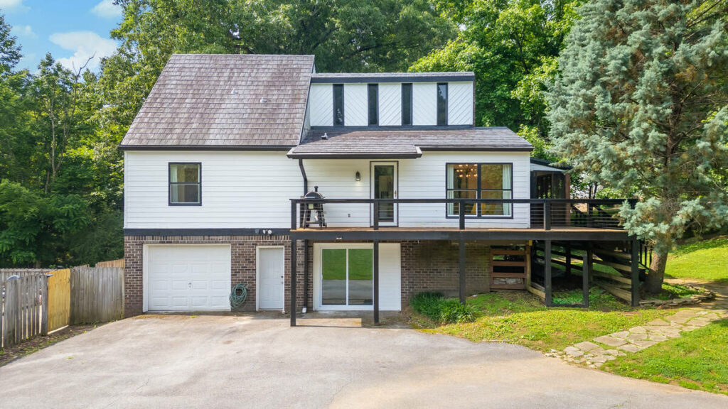 HDR real estate photo editing services for a bright home exterior with deck