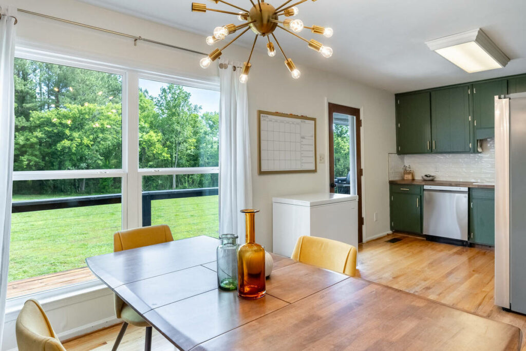 HDR real estate photo editing services balancing a dining and kitchen interior with outdoor views