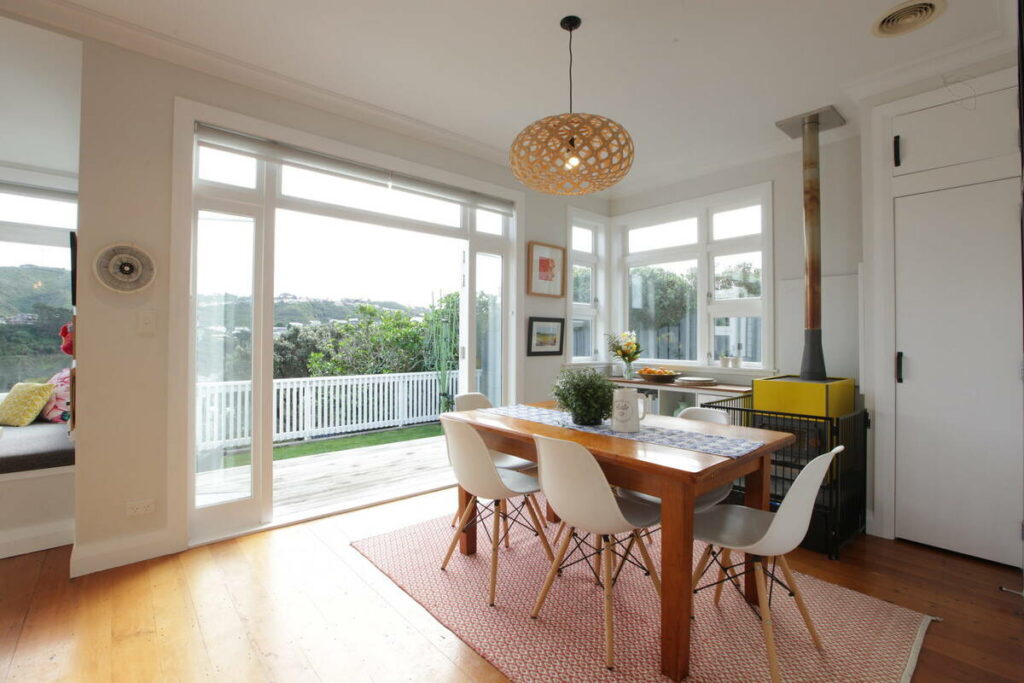 Dining room with bright windows before HDR real estate photo editing services