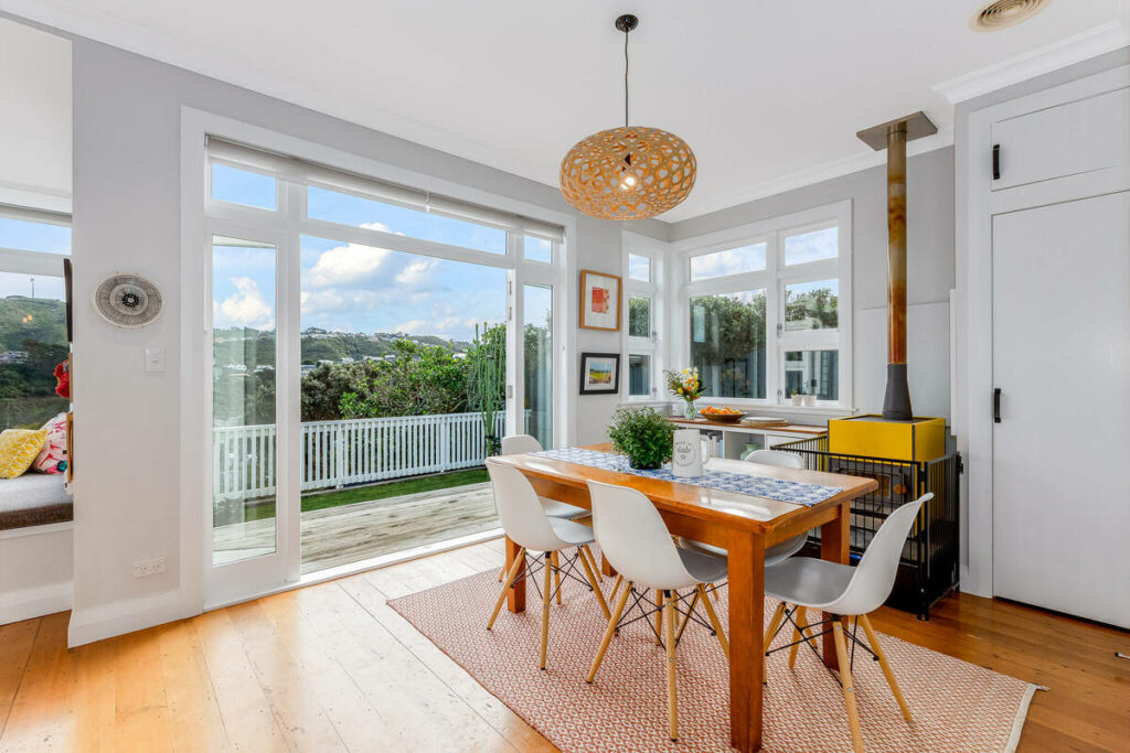HDR real estate photo editing services balancing a bright dining room and outdoor view