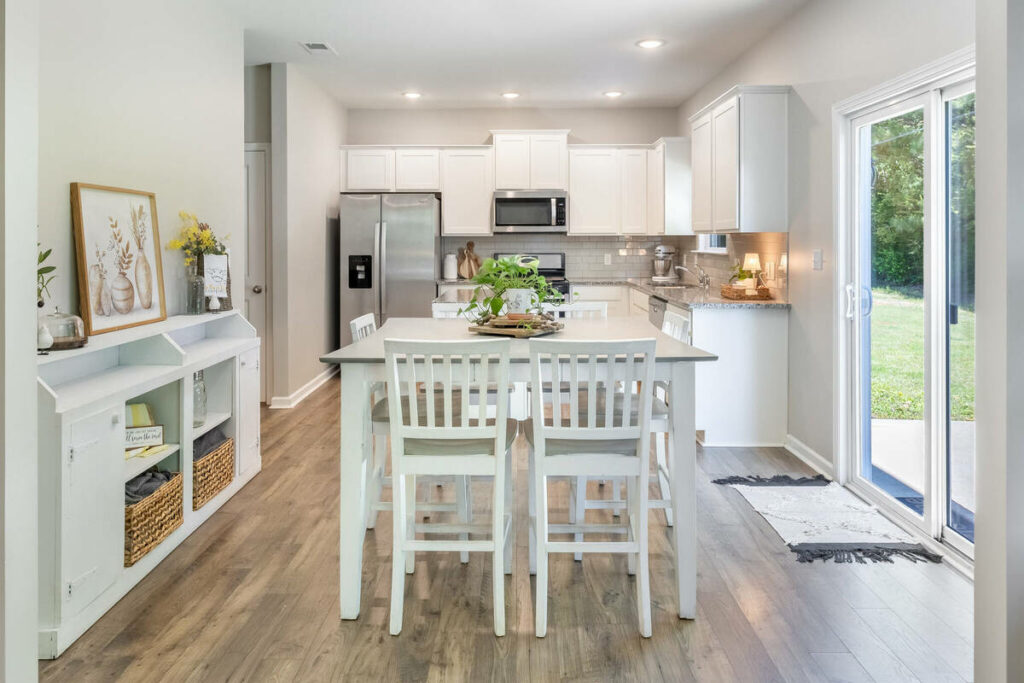 HDR real estate photo editing services for a bright kitchen and dining area