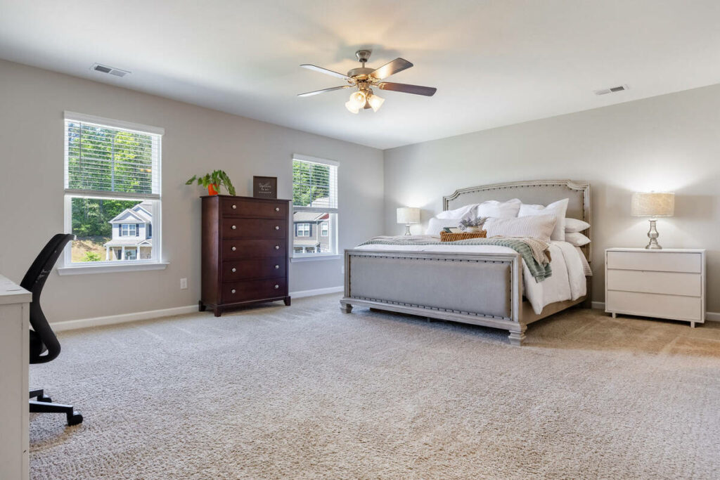 HDR real estate photo editing services for a bright primary bedroom