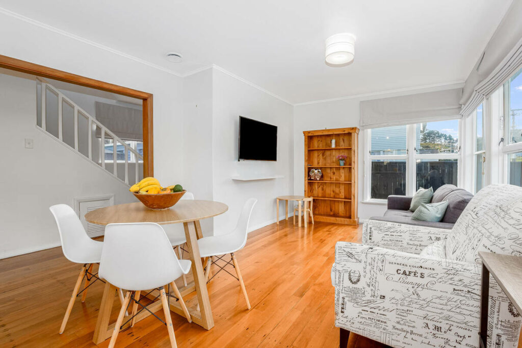 AI real estate photo editing of an open dining and living area