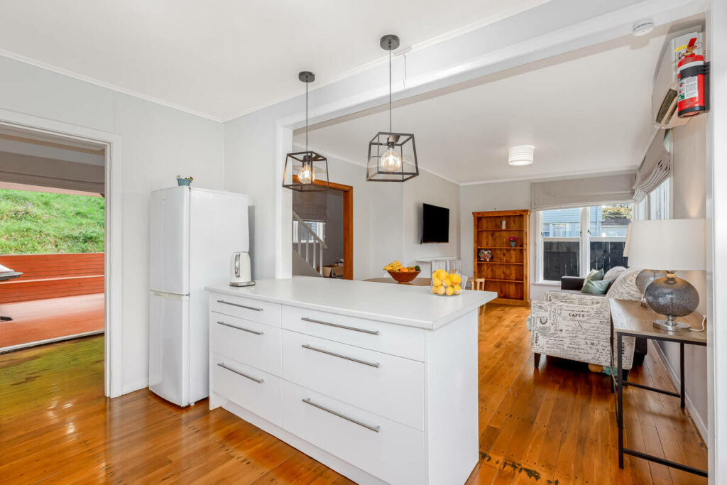 AI real estate photo editing of an open kitchen and living area