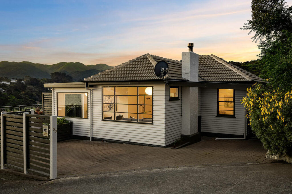 AI real estate photo editing of a home exterior at dusk