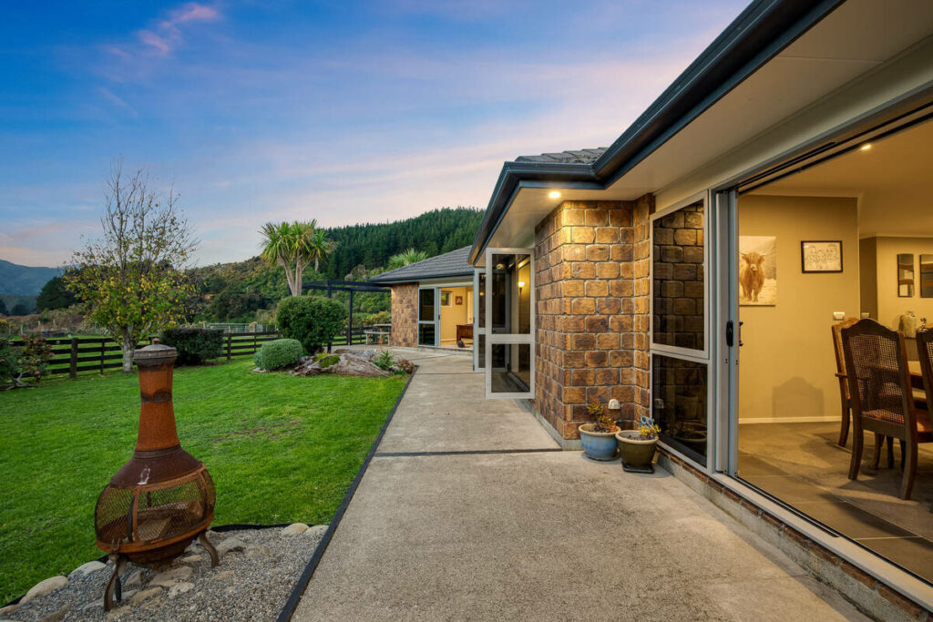 Exterior patio after AI real estate photo editing with enhanced sky and lighting