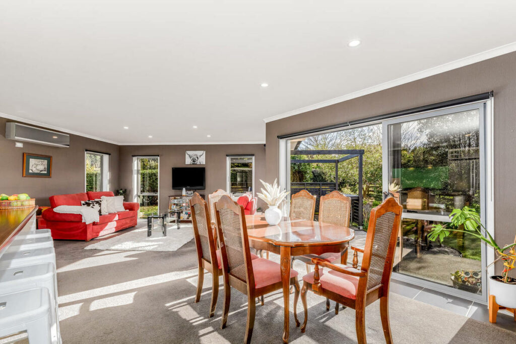 Dining room after AI real estate photo editing with balanced window exposure