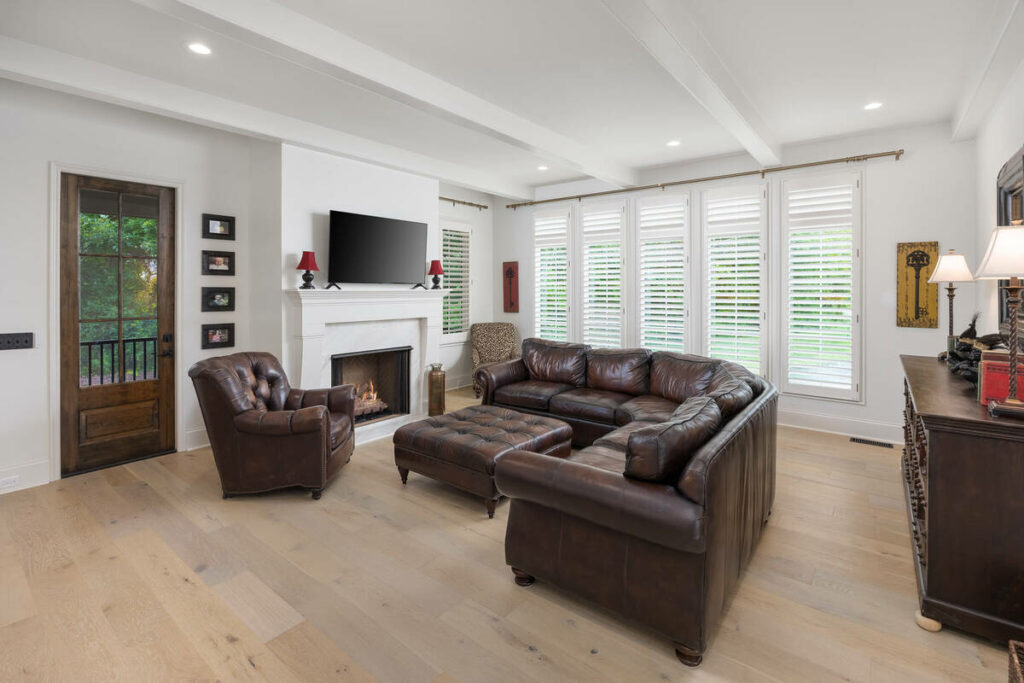 AI real estate photo editing of a bright living room with fireplace