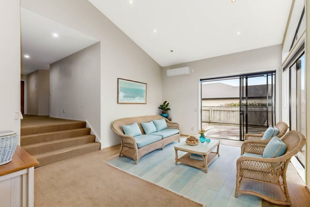 AI virtual staging of a coastal living room with wicker furniture