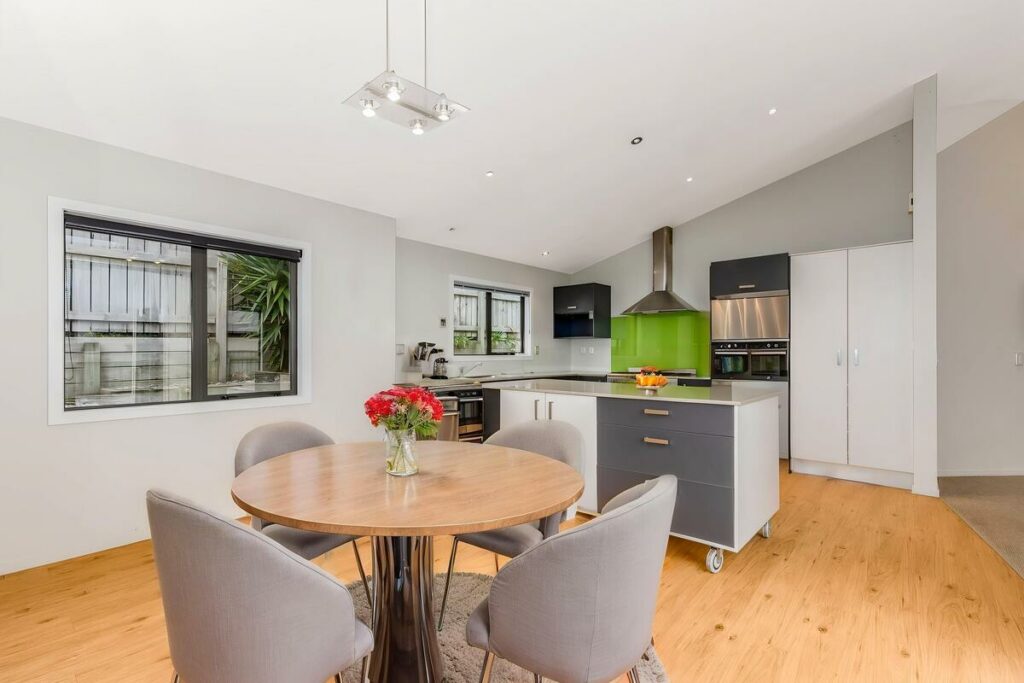 AI virtual staging of a dining area with a round table and chairs