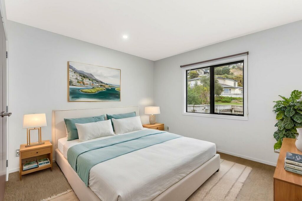 AI virtual staging of a bright bedroom with neutral furniture