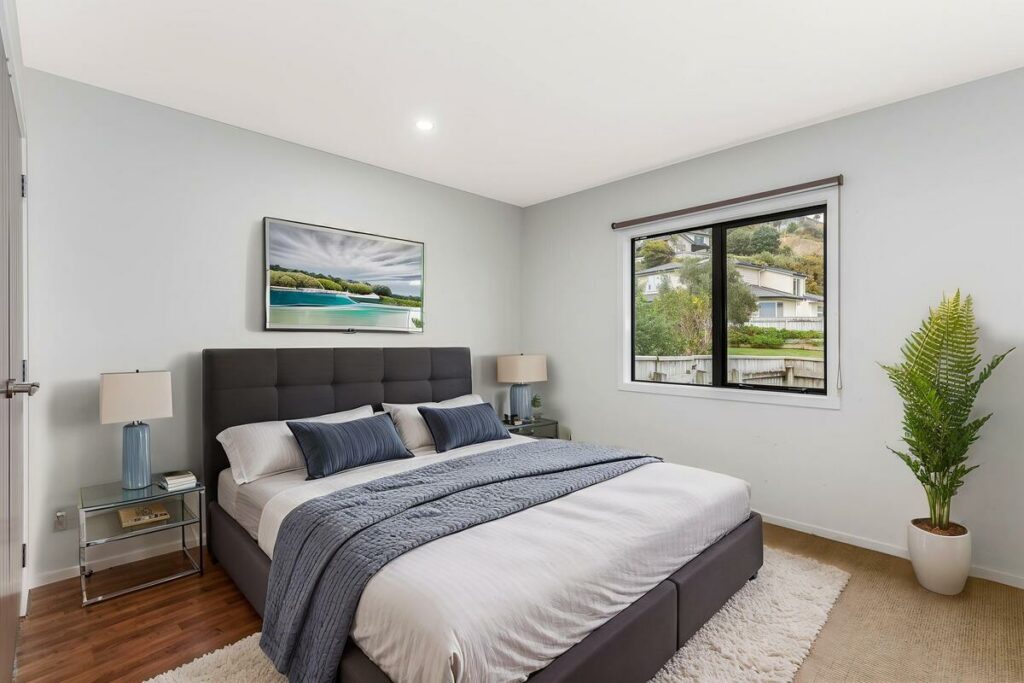 AI virtual staging of a contemporary bedroom with blue accents