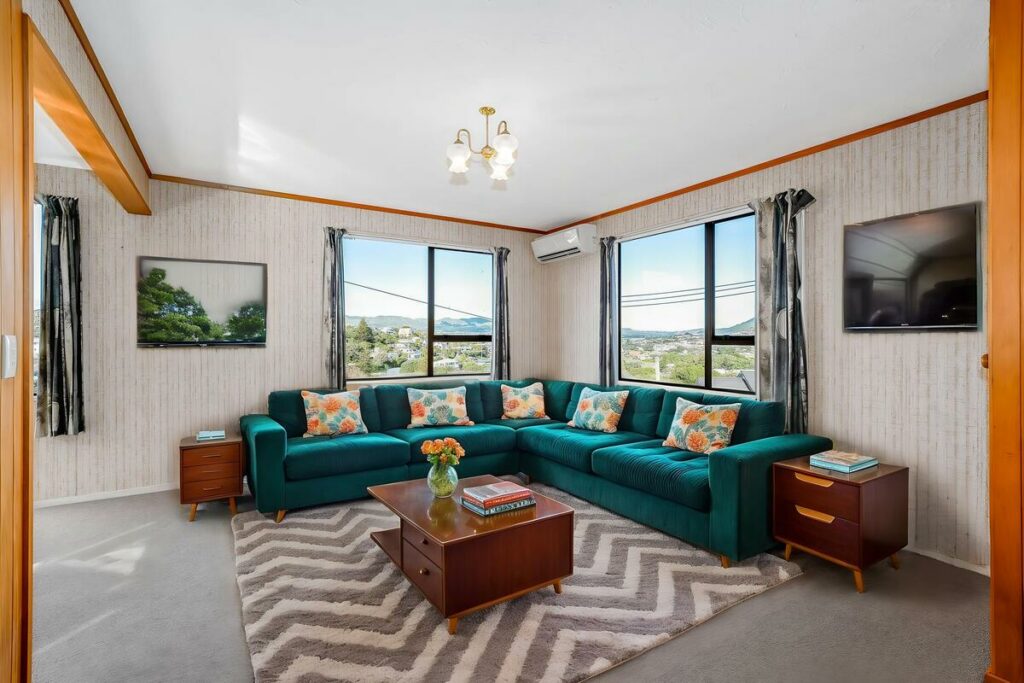 AI virtual staging of a living room with a teal sectional sofa