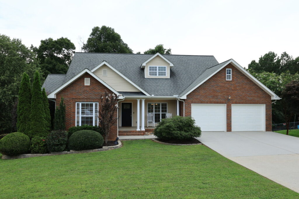 House exterior with overcast sky before professional photo editing