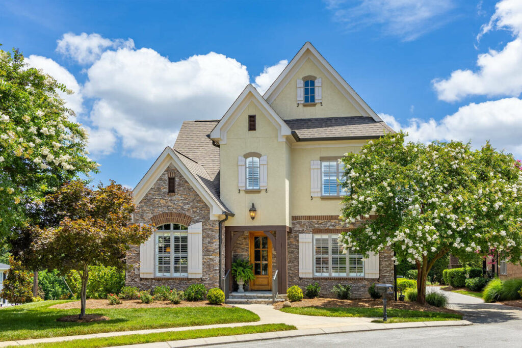 Professional photo editing of a bright residential property exterior