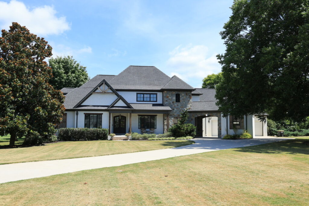 Luxury home exterior before professional photo editing