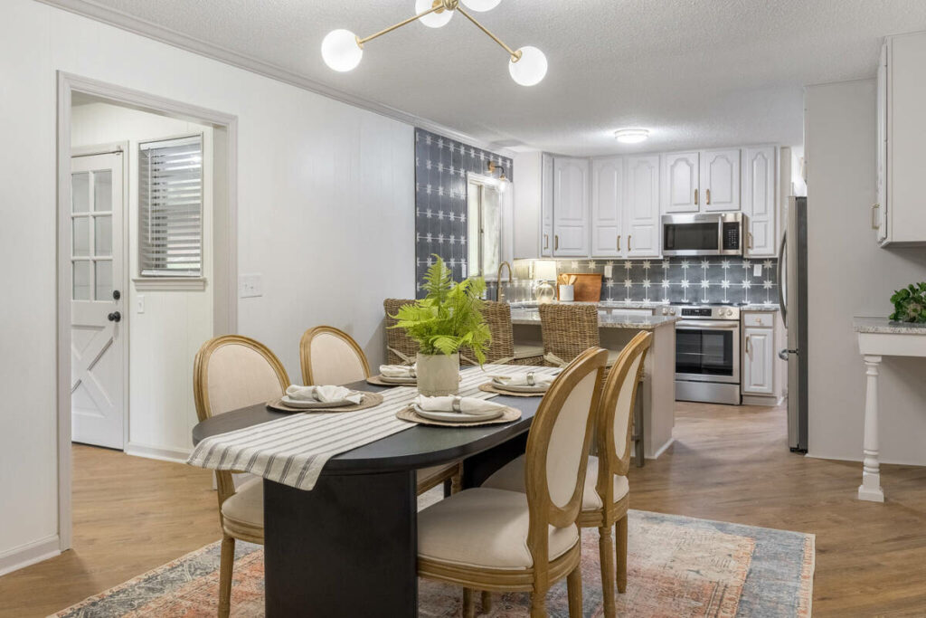 Professional photo editing of a dining area and kitchen