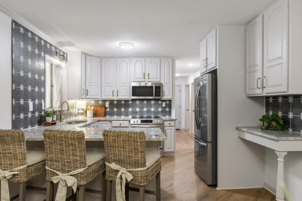 Professional photo editing of a bright modern kitchen