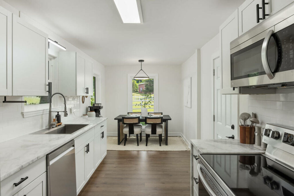 Bright kitchen enhanced with real estate photo editing services.