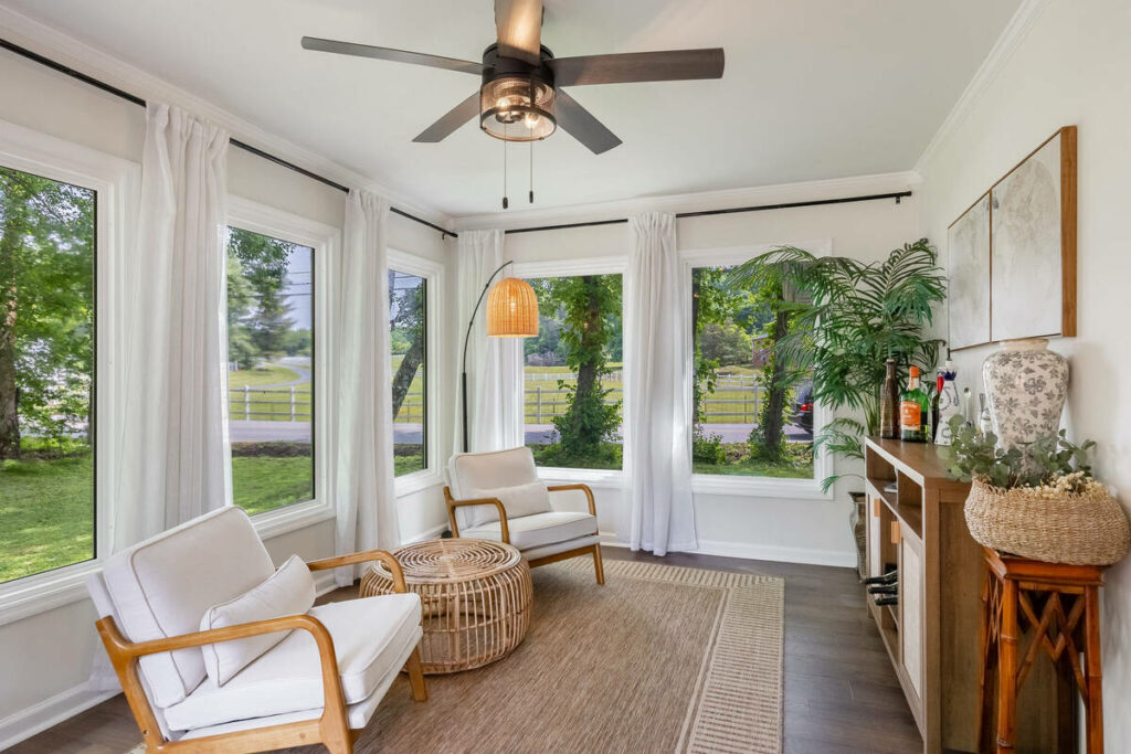 Bright sunroom enhanced with real estate photo editing services.