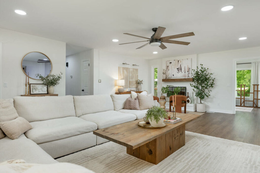 Spacious living room enhanced with real estate photo editing services.