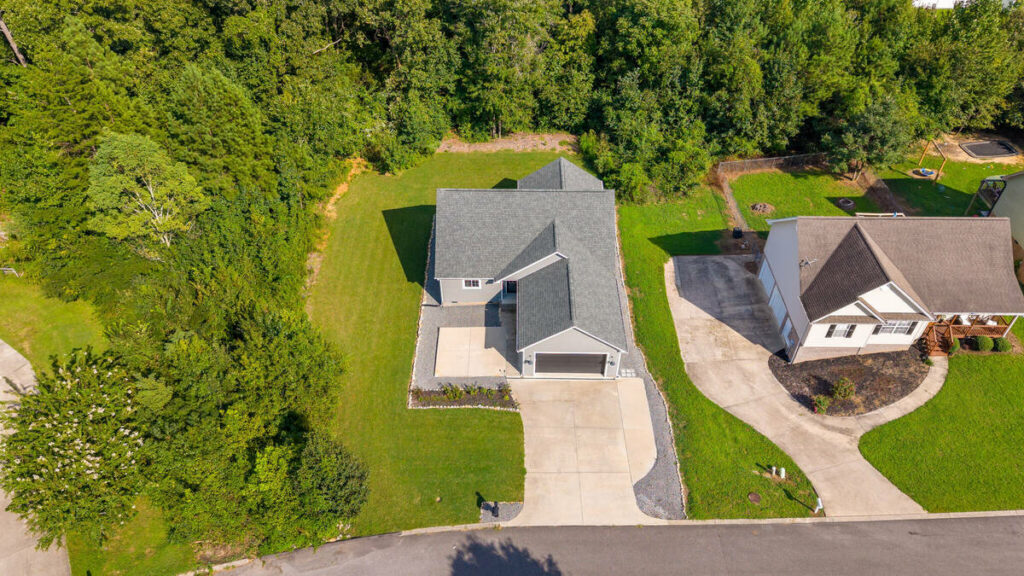 Aerial property photo enhanced with real estate photo editing services.